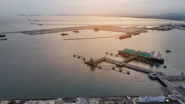 LNG (Liquified Natural Gas) tanker anchored in Gas terminal gas tanks for storage. Oil Crude Gas Tanker Ship. LPG at Tanker Bay Petroleum Chemical or Methane freighter export import transportation