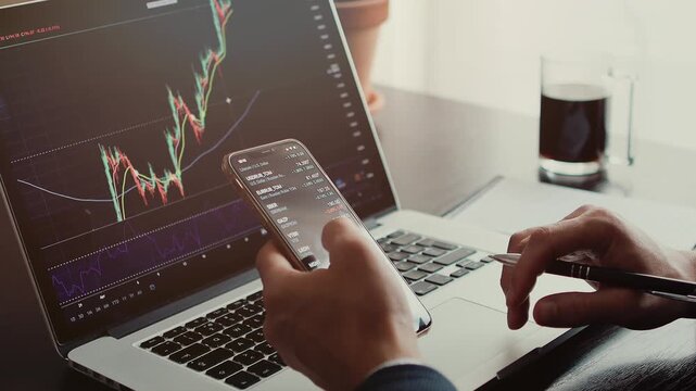 investment stockbroker stock market trading working day. stocktrader analyzing profit opportunity investing bitcoin. Crypto trader using phone and laptop indoors. 