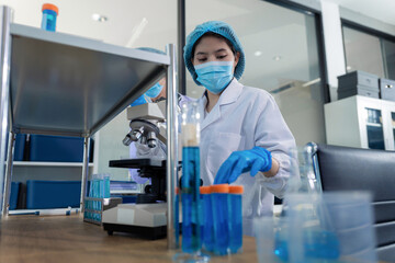 Naklejka premium Lab work, Doctor holds a test tube takes the test from a test tube in analysis, blood, DNA, test tube stand.