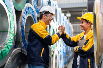 engineer technician colleagues standing handshake smile excited celebration project success output in warehouse, team of diverse workers working together at industrial manufacturing factory