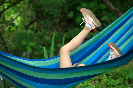 young woman relaxing in hammock