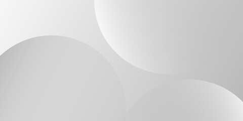 A minimalist abstract background featuring overlapping curves and circular shapes in various shades of gray, creating a smooth gradient and subtle depth