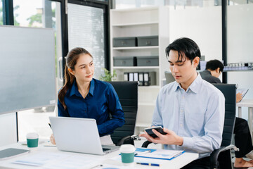 Fototapeta premium Office colleagues have a casual discussion. During a meeting in a conference room, a group of business teem sit in room new startup project.