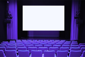 Fototapeta premium Empty cinema theater with purple seats and blank screen ready for projection