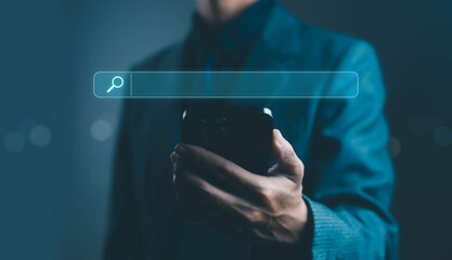 Businessman using smartphone with digital search bar interface, symbolizing online search, SEO, internet marketing, and digital technology concept in modern business communication.
