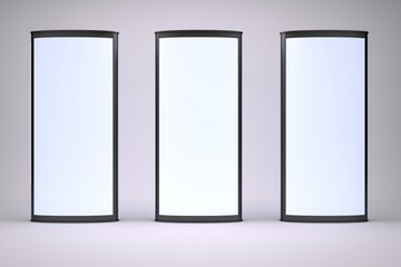 Three illuminated vertical display panels in a row against a neutral background