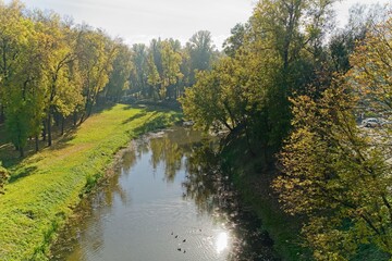  Vitebsk, Belarus, October 8, 2025. View of an autumn park from a bridge.                              