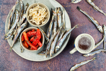 Unfiltered beer and with dried fish and squid.