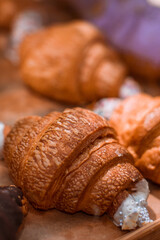Delicious traditional sweet croissants on the cafe counter