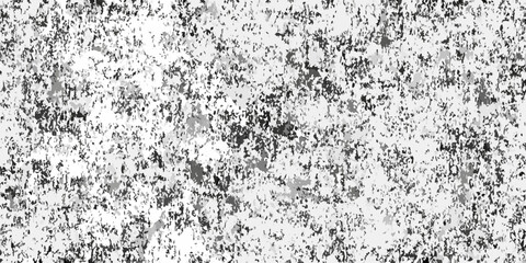 Obraz premium Abstract monochrome texture with a speckled pattern of dark and light gray shapes on a white background