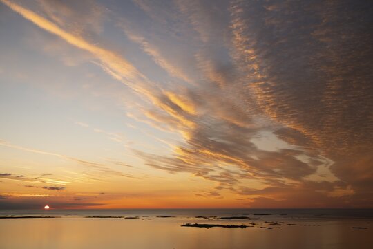 Offshore islands and skerries, sea, dramatically illuminated clouds, sunset, Otroya or Otr&oslash;ya island, M&oslash;re og Romsdal, Norway