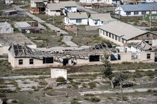Abandoned ruined buildings in a mountain landscape, ghost town, Engilchek, Tian Shan, Kyrgyzstan