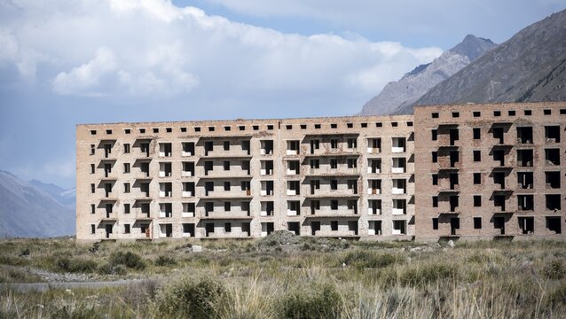 Panorama, Abandoned destroyed buildings in mountain landscape, Soviet apartment blocks, ghost town, Engilchek, Tian Shan, Kyrgyzstan