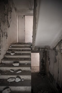 Abandoned destroyed staircase in a residential building, Soviet apartment blocks, ghost town, Engilchek, Tian Shan, Kyrgyzstan