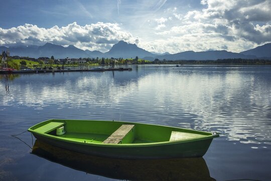Green rowing boat, Hopfensee, Hopfen am See, near F&uuml;ssen, Ostallg&auml;u, Allg&auml;u, Bavaria, Germany