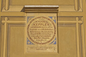 Inscription designed like a plaque: the four corners show stylised celestial bodies (sun, moon, stars and a comet), the text refers to the mathematician and astronomer Johannes Kepler, town hall, Ulm, Swabian Alb, Baden-Württemberg, Germany