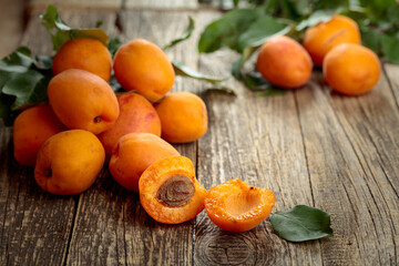 Fresh apricots on a old wooden table.