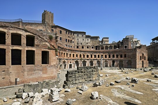 View of historic Traian's Forum Forum of Traian Foro Traiano from antiquity with building in semicircle at the back with colonnade in the foreground forecourt open space with column fragments remains of marble columns, Rome, Lazio, Italy