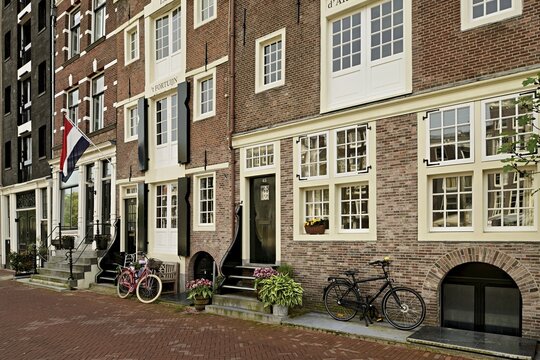 Bicycles in front of historic buildings, Herengracht 43, Amsterdam, Province of North Holland, Netherlands