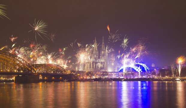 New Year's Eve fireworks, Hohenzollernbruecke with cathedral and Musical Dome, Rheinufer, Cologne, Rhineland, North Rhine-Westphalia, Germany