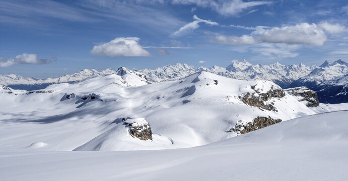 Mountain landscape with snow, view from the summit Wisshore to the Pointe de la Plaine Morte, behind summit of the Valais Alps, Bernese Alps, Switzerland