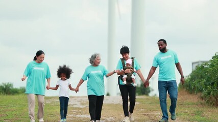Volunteers are walking behind a windmill farm, volunteer charity people. charity community service event, ngo business and outreach, Group Diverse people meeting at park for donation