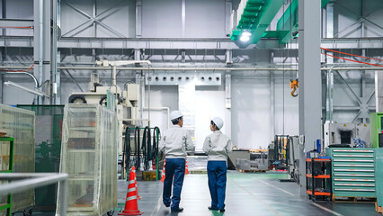 factory, back, rear view, worker, walking, inspection, maintenance, safety, teamwork, confirmation, check, woman, man, full body, moving forward, wide angle, machine, operator, engineer, manufacturing © metamorworks