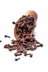 Dry cloves  spice  on white  background. A wooden spoonful of dried clove spice