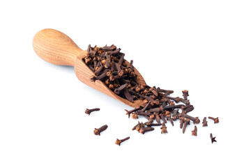 Dry cloves  spice  on white  background. A wooden spoonful of dried clove spice