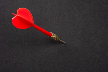 Red dart arrow on black  background	