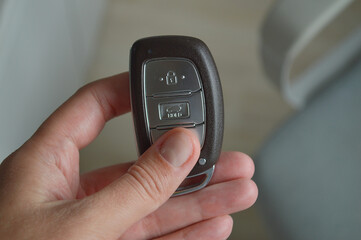 Modern car key fob held in hand