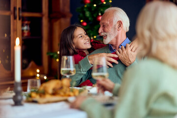Joyful Family Christmas Dinner With Grandfather And Granddaughter, New Year Celebration And Warm Moments