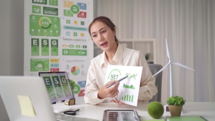 Asian adult woman presents ESG report online virtual meeting discussing sustainable business strategies environmental social governance performance global green logistics solutions - Powered by Adobe