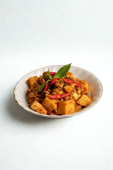 Savory stir fried tofu with vegetables and basil