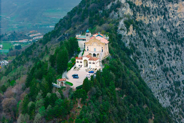 Sanctuary Montecastello church on top mountain near Lake Garda in Italy, aerial footage