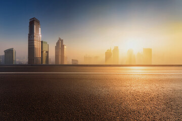 Empty Highway Road Over Modern City Skyline at Dawn – Copy Space Urban Background