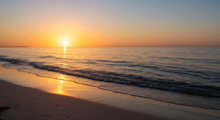 Fototapeta premium Sunrise over a peaceful beach on summer solstice, golden light, calm waves, minimal composition.