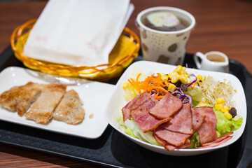 Taiwanese breakfast cafe serving bacon chicken with salad