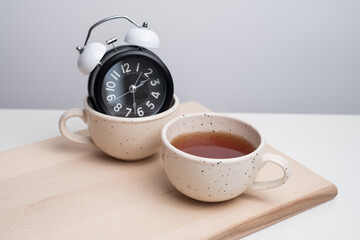 Coffee break time. Cup of coffee or tea on office desk. Business concept