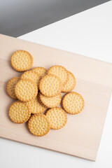 Sandwich cookies, cookies with chocolate cream filling in a crust. A modern cookie and packaging concept. A sweet snack and holiday concept.
