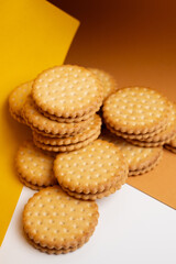 Sandwich cookies, cookies with chocolate cream filling in a crust. A modern cookie and packaging concept. A sweet snack and holiday concept.
