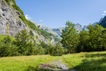 Obraz premium This landscape photo was taken in Europe, France, Auvergne-Rhone-Alpes, Haute-Savoie, Sixt-Fer-a-Cheval, in summer. It shows the hiking trail in the mountains of the Cirque du Fer-a-Cheval