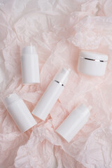 White bottles for cream, shampoo, toiletries, spa. Bottle with a dispenser for cosmetic products. Skin care and beauty concept. Mockup style, copy space