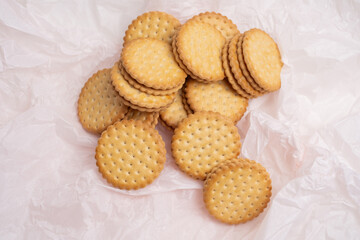 Sandwich cookies, cookies with chocolate cream filling in a crust. A modern cookie and packaging concept. A sweet snack and holiday concept.