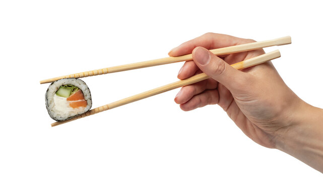 Sushi roll held by chopsticks with a hand. Isolated on transparent background, png