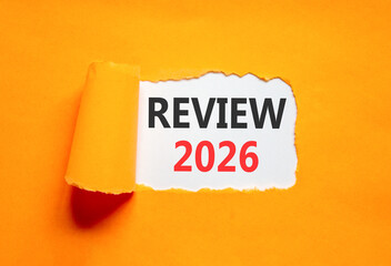 Review 2026 symbol. Concept words Review 2026 on beautiful white paper. Beautiful orange paper background. Business and review 2026 concept. Copy space.