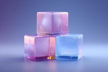 Three translucent ice cubes, various pastel shades, stacked, against a muted background.