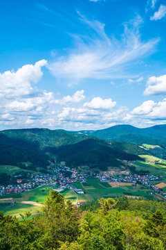 Germany, Aerial nature landscape view in schwarzwald town fischerbach im kinzigtal above the green tree tops of the forest, sunny day in summer