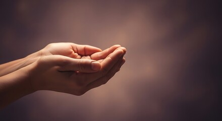 An empty pair of cupped hands held open with a soft, blurry, warm-toned background, suggesting an offering or receiving gesture