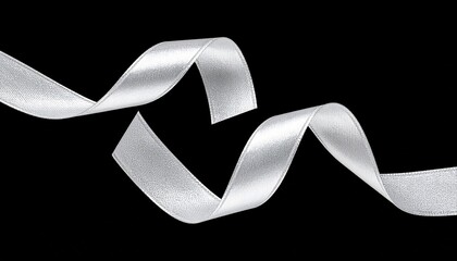 Elegant white satin ribbon, gracefully flowing and unfurling against a stark black backdrop, offering a luxurious and sophisticated decorative element for various design projects